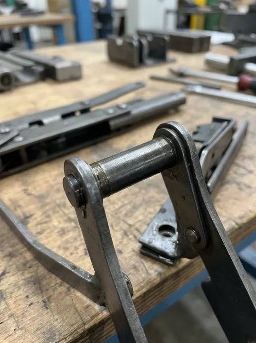 Butterfly chair mechanism pivot pin hardened steel detail