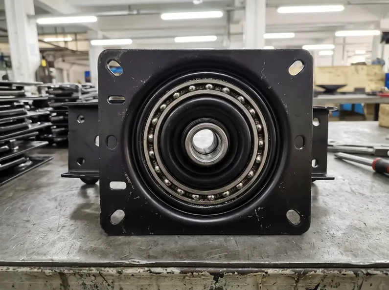 Swivel chair mechanism assembly — seat plate, bearing race, and gas lift column interface