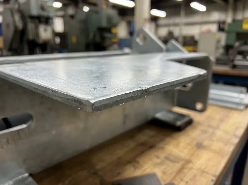 Cold-rolled steel plate detail showing 2.0–2.5mm thickness and zinc plating finish