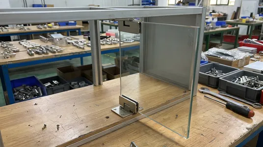 Pivot hinge system for frameless and glass door applications